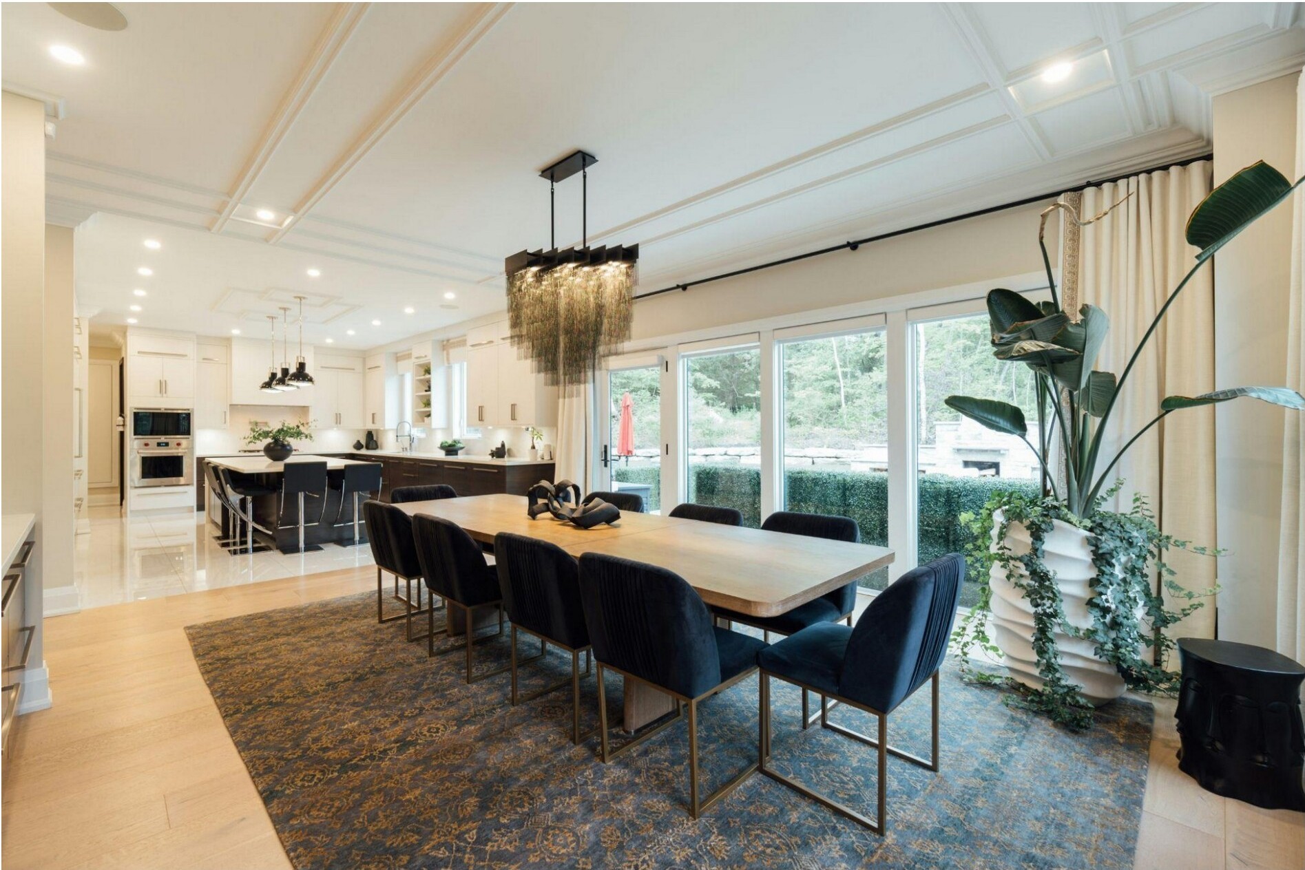 Interior of a modern home with a dining area and kitchen